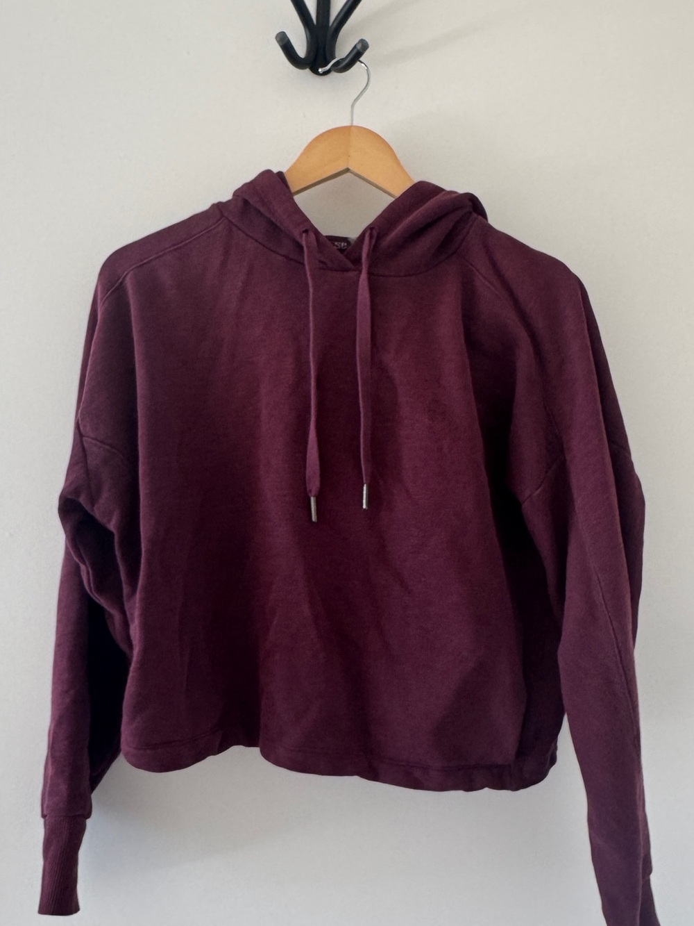Sweaty Betty cropped hoodie in a rich burgundy / plum shade, size XS.